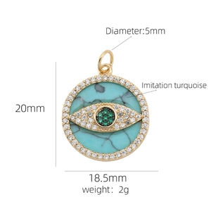 Detailed size specifications for the 18K gold evil eye pendant with green crystals