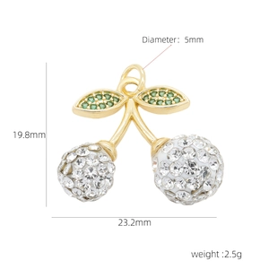 Macro view of cherry pendant size dimensions with clear rhinestones and green leaves