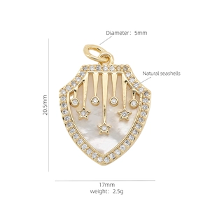 Macro detail of shield-shaped 18K gold pendant with mother of pearl and zircon inlay
