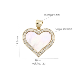 Detailed view of 19mm heart pendant with natural seashell and 18K gold plating