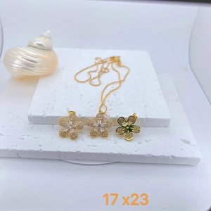 Close-up of 17x23mm gold flower pendants with colorful cubic zirconia pavé stones