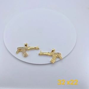 Detail of AK-47 pendant with white cubic zirconia and frosted honeycomb texture back