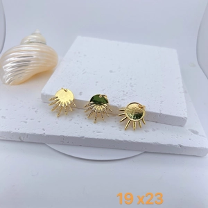 Detailed view of 19x23mm gold-plated sunburst pendants with micro-pave zircons