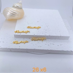 Detail of Always letter charm in gold plated copper with 26mm x 6mm dimensions