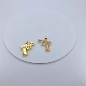 Hip hop style gold pistol pendant necklace featuring sparkly clear zircon stones