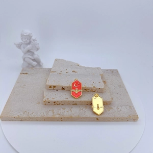 Hexagonal bumblebee moon pendant with red enamel inlay and golden metal back
