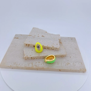Close-up of teardrop evil eye pendants with vibrant fluorescent enamel and gold plating
