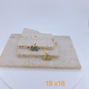 Detail view of 18x18mm elephant pendants with blue enamel evil eye and gold texture