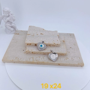 Detailed view of heart-shaped evil eye pendant with cubic zirconia and 19x24mm size