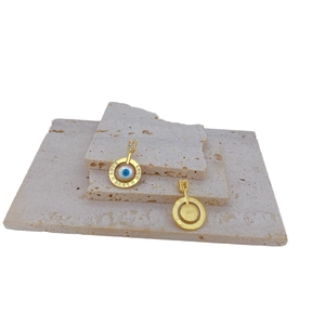 Gold plated evil eye charm with LOVE engraving and crystal arrow detail in main view