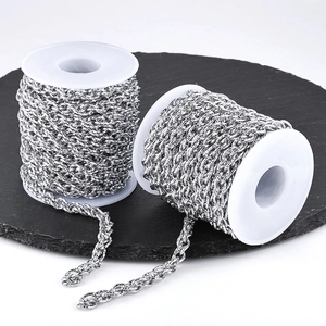 Polished silver stainless steel twist chains on white spools for DIY jewelry making