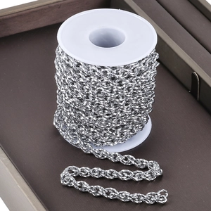 Macro shot of silver stainless steel twisted link chain on spool for DIY jewelry