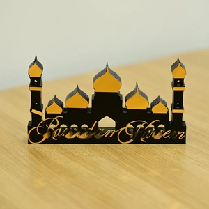 Detail of Ramadan Kareem desk decor with gold mosque silhouette on black acrylic base