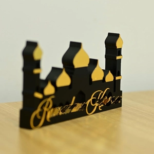 Ramadan Kareem mosque silhouette decor in black and gold acrylic on wood desk