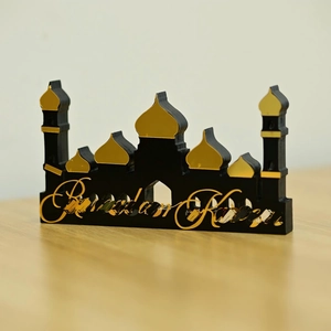 Elegant black and gold Ramadan Kareem mosque silhouette desk decor on wooden table