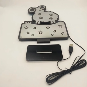 Detail view of cartoon sheep infinity mirror light with black USB base and cable