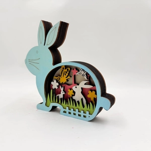 Detail of multi-layer laser cut wooden Easter bunny with 3D floral landscape scene