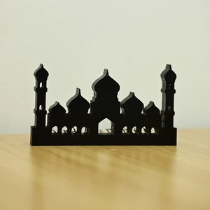 Detail of laser-cut black acrylic mosque silhouette with intricate 3D architectural layers