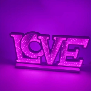 Macro detail of LOVE letter infinity mirror LED lamp with deep purple light effect