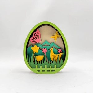 Multi-layered wooden Easter egg ornament featuring carved chicken and floral rural scene