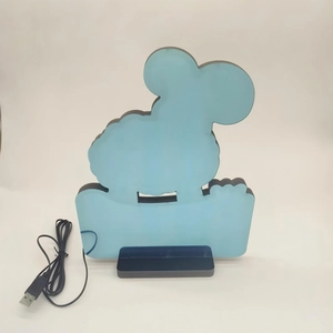 Detail of goat-shaped LED tunnel mirror lamp with black base and USB power cable