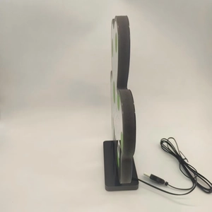Detail view of St. Patrick’s Day clover LED light with black USB cable and stable base
