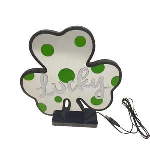 Detail of St. Patrick's Day Lucky clover LED night light with USB power cable and black base