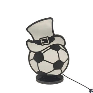 Detail view of football hat LED desk lamp with acrylic panel and black base stand