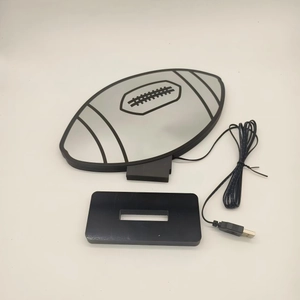 Detail view of American football LED lamp parts with light panel, base, and USB power cable