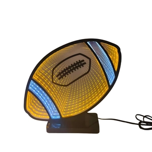 Detail of rugby-shaped 3D infinity mirror LED lamp showing yellow and blue neon lights