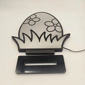 Vue détaillée de la lampe tunnel LED en forme d'œuf avec motifs floraux et base noire