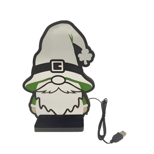Macro view of St. Patrick's Day gnome neon light with clover hat and USB connection