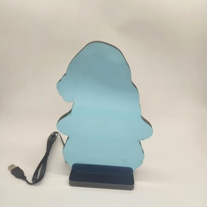 Close-up of Saint Patrick's Day gnome night light with blue protective film and USB base