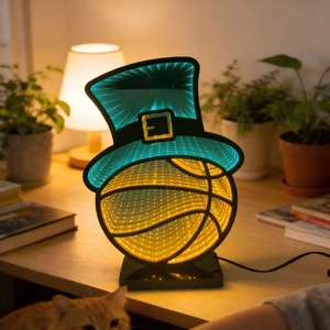 Detailed close-up of a 3D infinity mirror basketball lamp with a green St. Patrick's hat