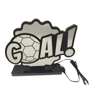 Detail of football LED goal lamp with acrylic panel, black base and USB cable connector