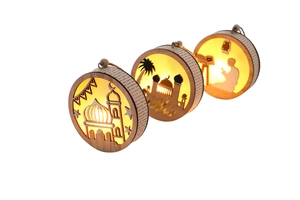 Detail of wooden Eid Mubarak hanging decorations with warm LED lights and twine