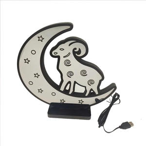 Detail of moon and sheep LED tunnel light with USB cable and minimalist black base