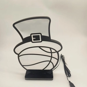 Detail of creative neon-style basketball lamp with top hat design and USB power cable