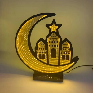 Detail of 3D infinity mirror LED moon lamp showing mosque silhouette and warm glowing light