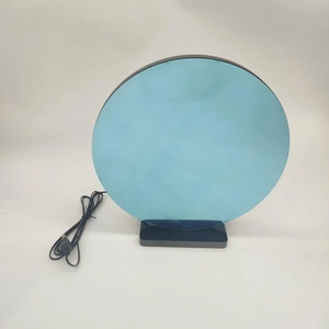 Detail of blue acrylic basketball ambient light with black USB base on white background