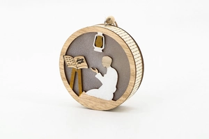 Detailed laser-cut wooden Ramadan pendant featuring a praying figure and Islamic motifs