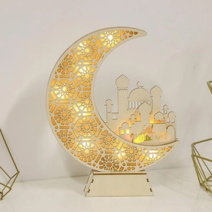 Detail of wooden crescent moon lamp with LED light and hollow geometric patterns