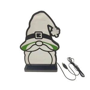 Close-up of Saint Patrick's Day gnome LED lamp with USB cable and green clover detail