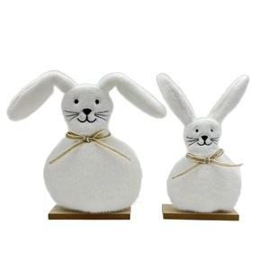 Two plush white Easter bunny figurines on wooden bases for home tabletop decoration