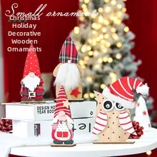Christmas gnome and owl wooden tabletop decor set with festive holiday lights background