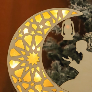 Close-up of wooden crescent moon LED light with intricate geometric cutout patterns