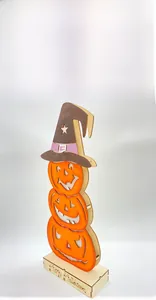 Close-up of laser-cut wooden Halloween tiered pumpkin lanterns with wizard hat and base