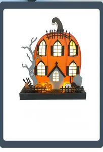 Detail of wooden Halloween pumpkin house showing intricate LED glowing window carvings