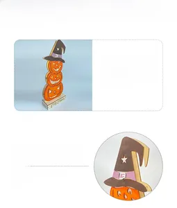 Detail of stacked wooden pumpkins with wizard hat and LED glowing Happy Halloween text