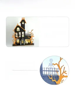 Detail of Halloween wooden LED light box showing haunted house with ghosts and pumpkins
